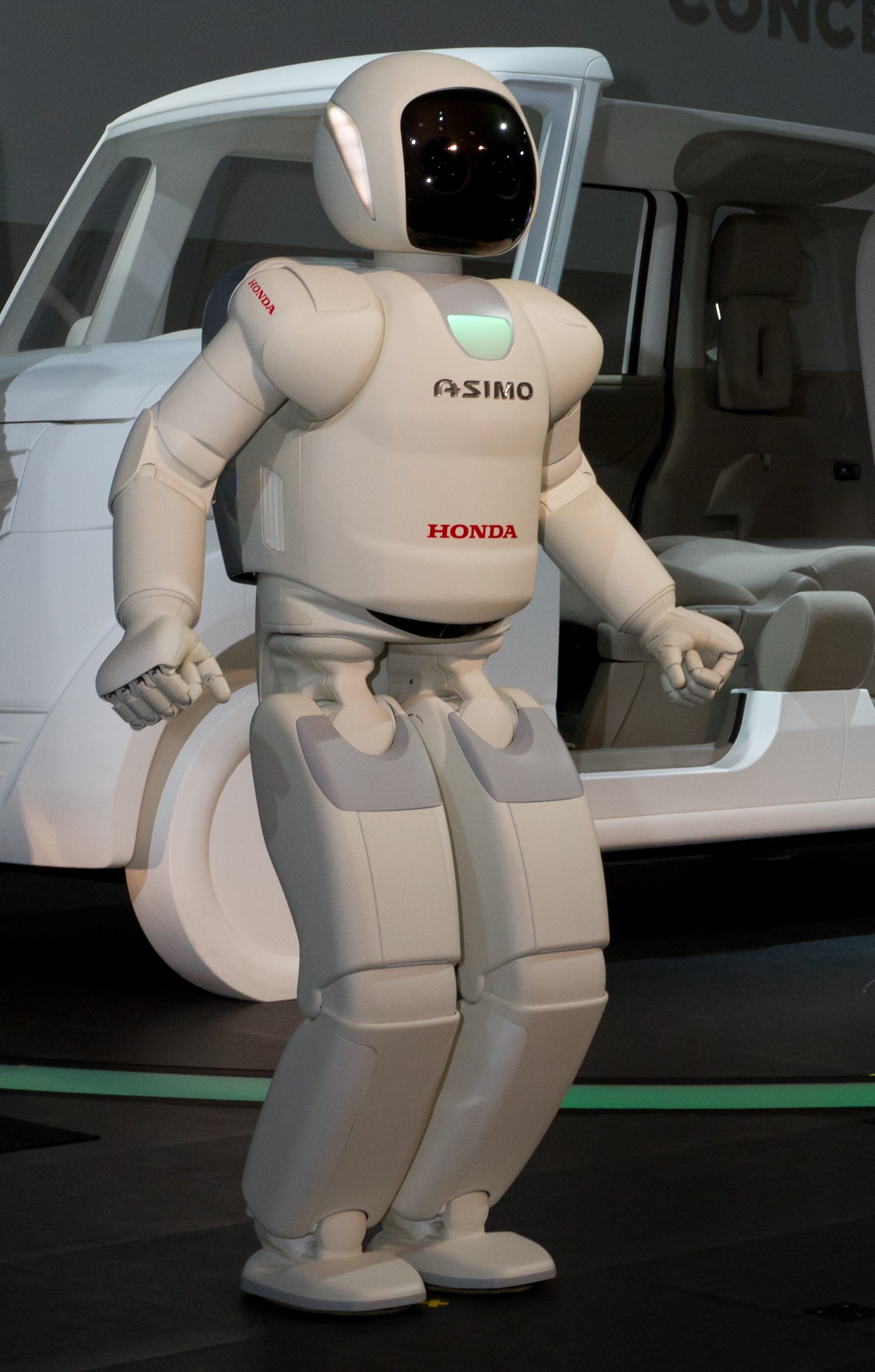 Figure 1.3: Honda ASIMO (2000–2011) — the canonical integration of LIPM, ZMP, and preview control into a production biped. An icon of the Japanese orthodox lineage. — source: Honda press / Wikimedia Commons, CC license, fair use for academic review